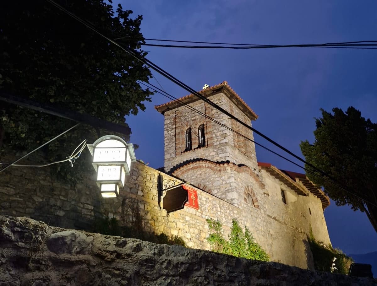 A stone church illuminated during an evening walk in Ohrid