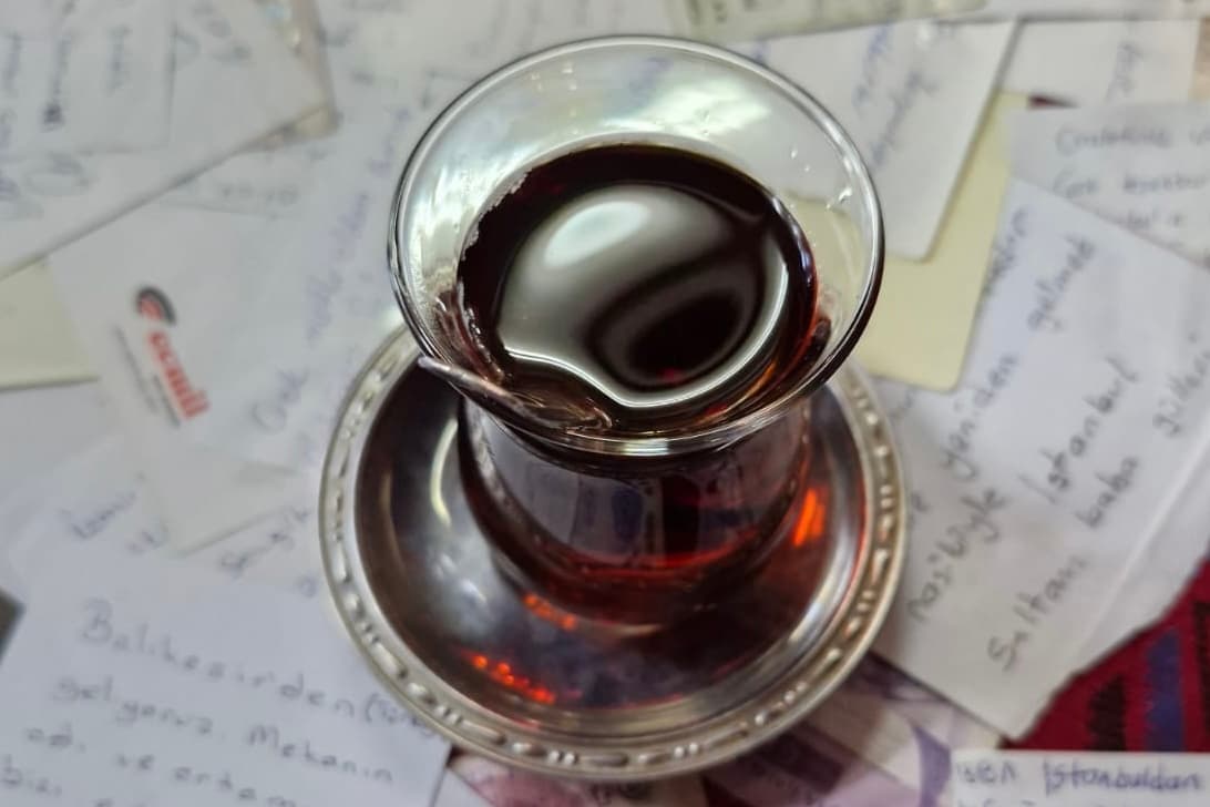 Traditional tea surrounded by messages from Ohrid travellers